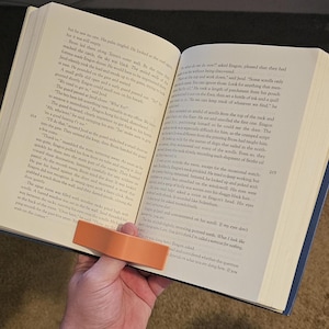 Portapagina ergonomico per libri con una sola mano: impugnatura per il pollice per una facile lettura e un apprendimento confortevole