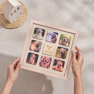 Puede incluir: Un marco de fotos cuadrado rosa claro con nueve fotos cuadradas de un Golden Retriever. Un cuadrado de madera en el centro est&aacute; grabado con el nombre "Nellie" y la frase "Once by my side forever in my heart."