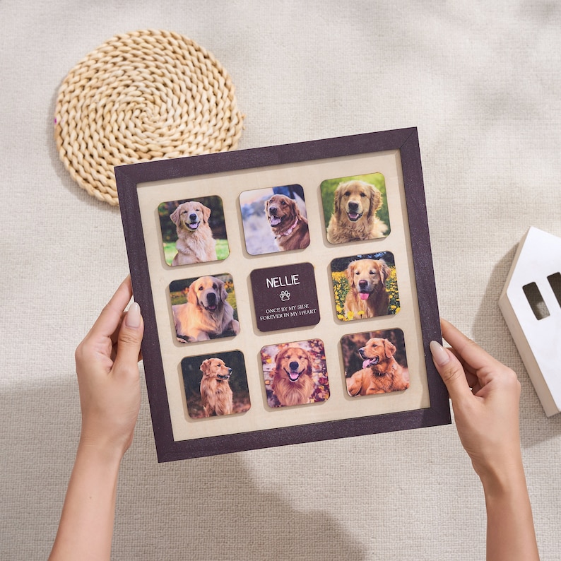 Puede incluir: Un collage de fotos cuadrado con marco marr&oacute;n oscuro que presenta nueve fotos cuadradas de un golden retriever. La foto central tiene el nombre "Nellie" y el texto "Once by my side, forever in my heart". El marco lo sostiene una persona.