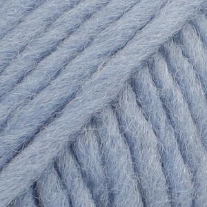May include: A close-up view of light blue yarn featuring a thick, multi-ply twisted construction with a soft, fuzzy texture. The individual strands are tightly wound together, creating a consistent diagonal pattern across the entire surface.