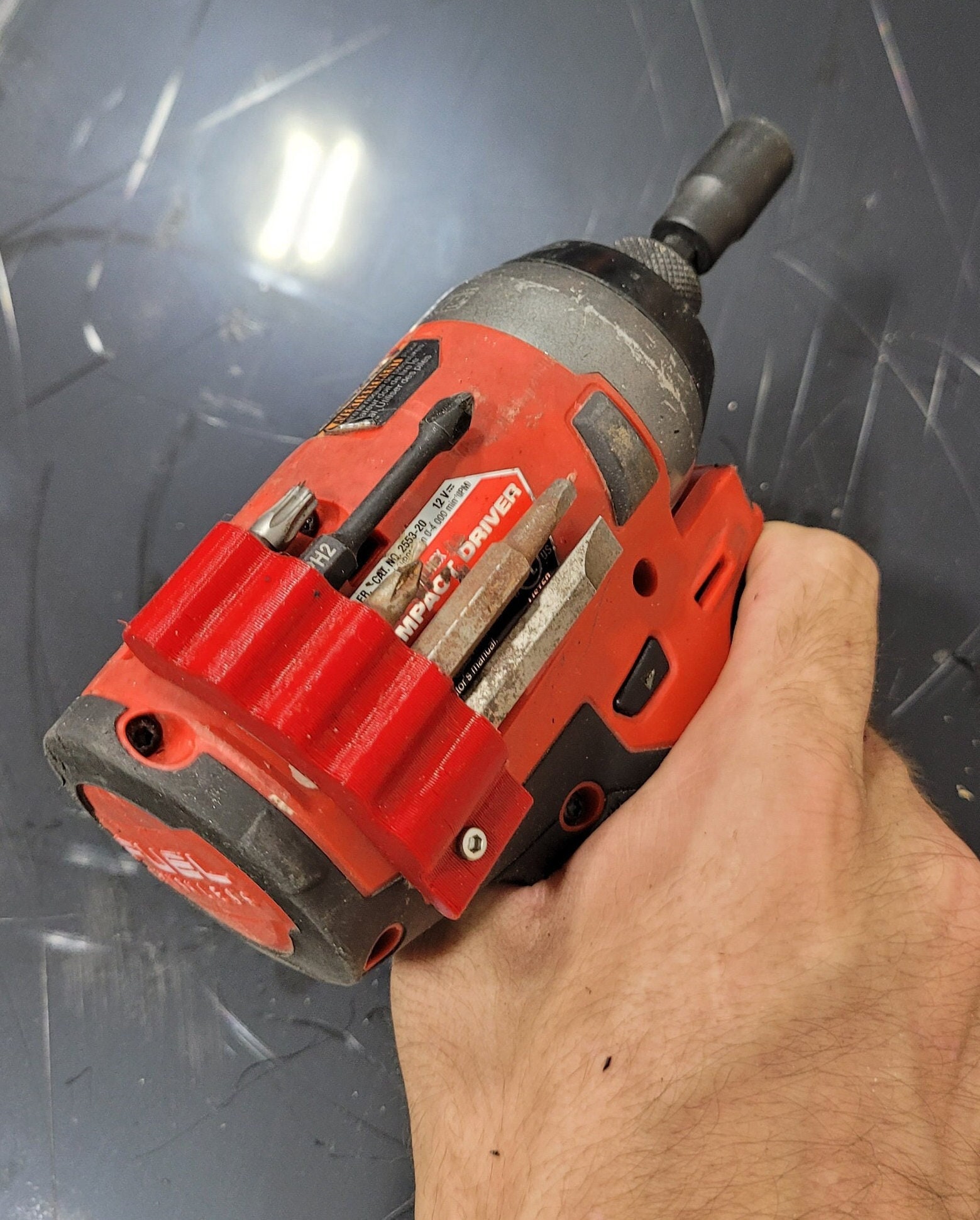 5-spot Milwaukee M12 Fuel Impact Driver Magnetic Drill image image