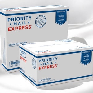 May include: Two white Priority Mail Express flat rate boxes with blue and red text. The boxes have the words "Priority Mail Express" and "Guaranteed, Tracked, Insured" printed on them. One box is labeled "Medium Flat Rate Box".