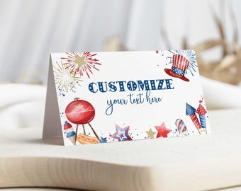 May include: A white folded card featuring red, white, and blue watercolor illustrations of fireworks, a top hat, a grill, a hot dog, and stars. The text CUSTOMIZE your text here is printed in blue in the center of the card.