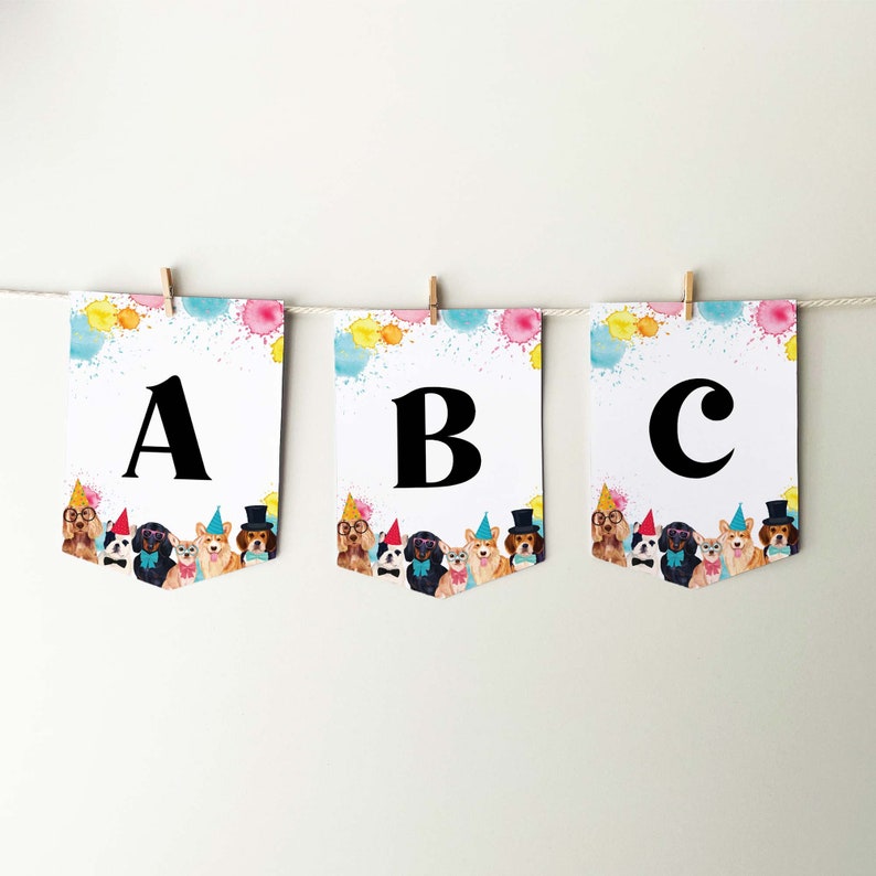 May include: A colorful banner with the letters A, B, and C. Each letter is surrounded by a watercolor design of colorful splatters. The banner features a row of cartoon dogs wearing party hats.