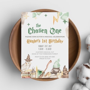 May include: A rectangular birthday invitation card featuring watercolor illustrations of an owl wearing a hat, a lantern, a broomstick, a cauldron, and books. The text reads: the Chosen One, Hunter's 1st Birthday, Sunday 31st July, 9.30am-11.30am.