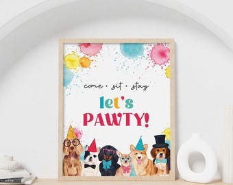 May include: A rectangular wall print featuring watercolor splashes in pink, yellow, and blue. The text reads "come • sit • stay" and "let's PAWTY!". Below, six dogs wear party hats, bow ties, and glasses in a colorful, festive illustration.