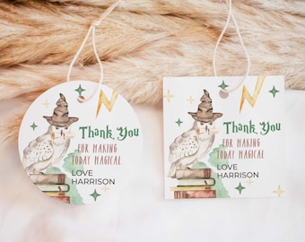 May include: Two white gift tags, one circular and one square, featuring a watercolor owl wearing a pointed hat, perched on a stack of books. The text reads: Thank You FOR MAKING TODAY MAGICAL LOVE HARRISON. Includes gold lightning bolts and stars.