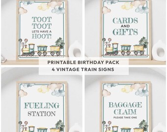 May include: Four rectangular signs in light wood frames featuring watercolor train illustrations, clouds, and text. The signs read: TOOT TOOT LETS HAVE A HOOT, CARDS AND GIFTS, FUELING STATION, and BAGGAGE CLAIM PLEASE TAKE ONE.