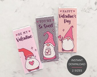 May include: Three rectangular chocolate bar wrappers featuring gnome illustrations. The left wrapper is light pink with the text BE MY Valentine. The center is gray with YOU'RE So Sweet. The right is light pink with HAPPY Valentine's Day.