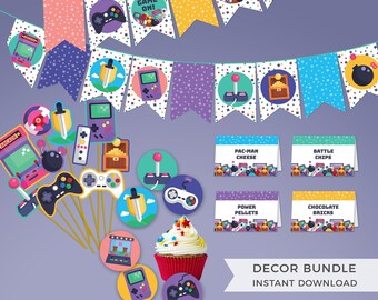 May include: A video game themed party decor set featuring a pennant banner with gaming icons, cupcake toppers on wooden sticks, and four folded food labels labeled Pac-Man Cheese, Battle Chips, Power Pellets, and Chocolate Bricks.