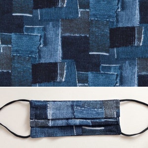 May include: A blue face mask with a patchwork design made from different shades of blue denim fabric. The mask has a pleated design and is made with two layers of fabric.