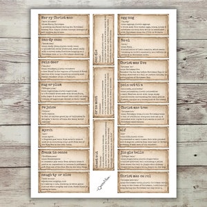 May include: A set of 12 vintage-style Christmas vocabulary cards with definitions. The cards are printed on a light brown background with a distressed, aged look. The cards feature words like "candy cane", "reindeer", "sugarplum", "eggnog", "Christmas Eve", and "Christmas carol".