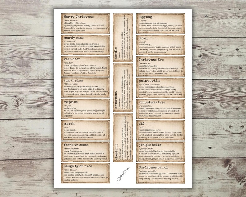 May include: A set of 12 vintage-style Christmas vocabulary cards with definitions. The cards are printed on a light brown background with a distressed, aged look. The cards feature words like "candy cane", "reindeer", "sugarplum", "eggnog", "Christmas Eve", and "Christmas carol".