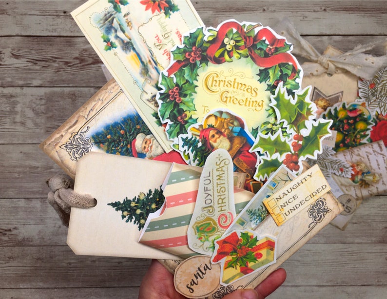 May include: A collection of vintage Christmas-themed paper ephemera, including a wreath with the text "Christmas Greeting", a tag with the text "Joyful Christmas", and a tag with the text "Naughty, Nice, Undecided".