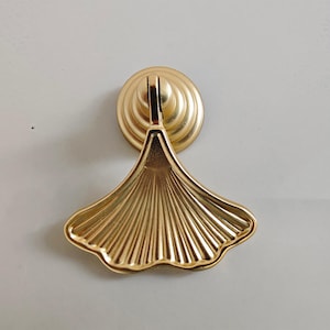 Gouden ventilatorkastknop: shabby-chic dressoirladetrekker