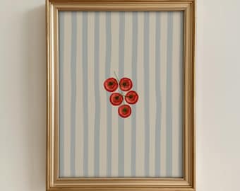 May include: A framed print with a watercolour illustration of five red cherry tomatoes on a green stem. The background has vertical stripes in light blue and beige. The frame is gold.
