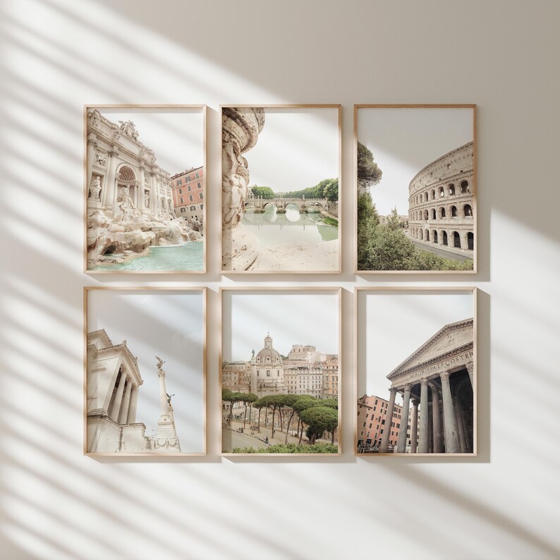 May include: A set of six framed photographs of various landmarks in Rome, Italy. The photos are in a muted color palette and feature the Trevi Fountain, a bridge over a river, the Colosseum, a building with a dome, a column with a statue, and a temple.