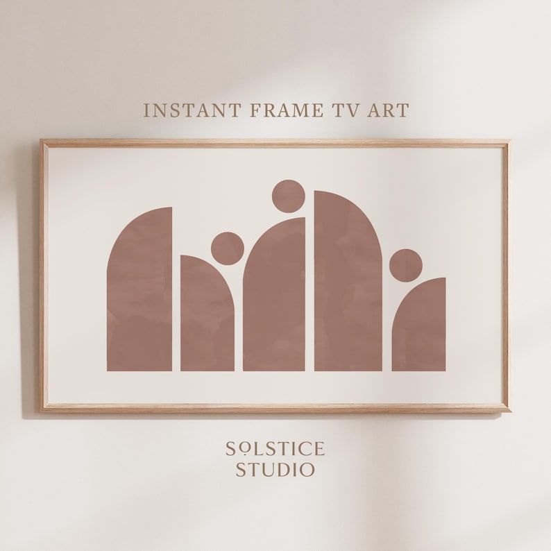 May include: A digital print of an abstract geometric design in shades of brown. The design features a series of rounded shapes arranged in a wave-like pattern. The print is framed in a light wood frame. The text "INSTANT FRAME TV ART" and "SOLSTICE STUDIO" is visible below the image.