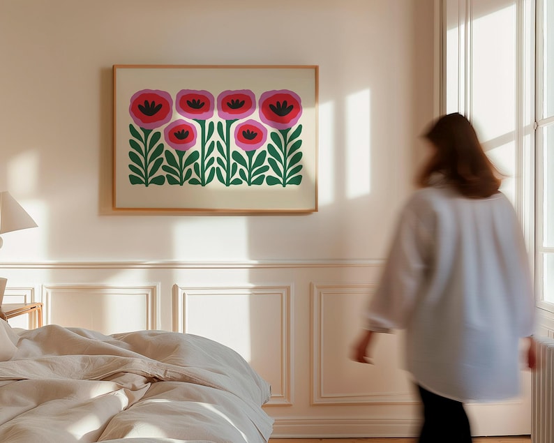 May include: A framed print of a stylized floral design featuring pink and red flowers with green leaves on a white background.