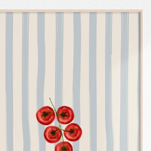May include: A watercolour painting of a bunch of ripe red tomatoes on a green stem. The background has vertical stripes in light blue and cream, creating a fresh feel. The artwork is framed.