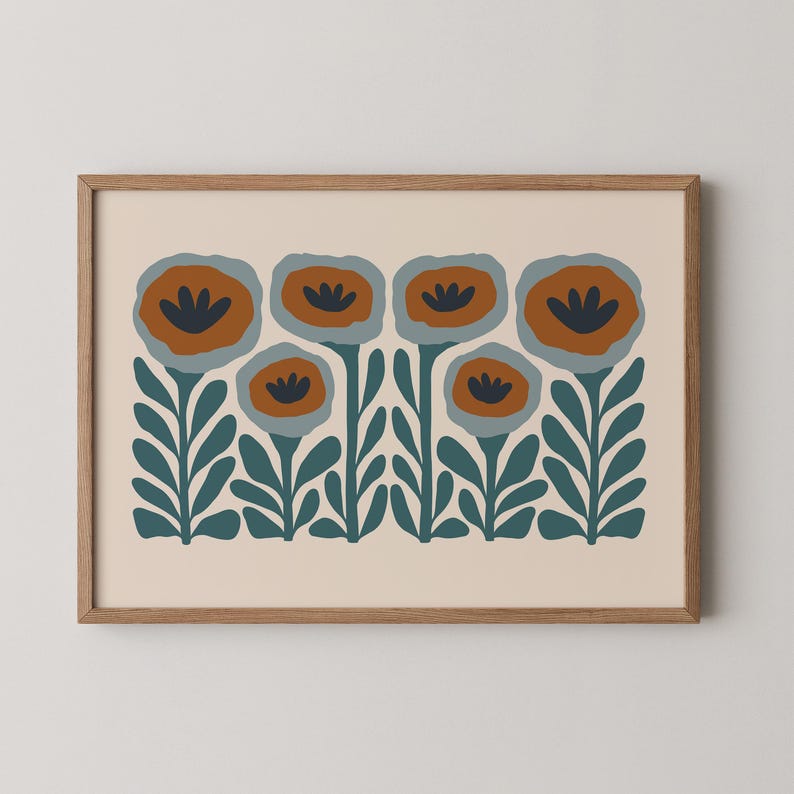 May include: A framed art print featuring a stylized floral design. The artwork showcases six flowers with orange and navy blue petals, set against a cream background. The stems and leaves are a deep teal color, all within a wooden frame.