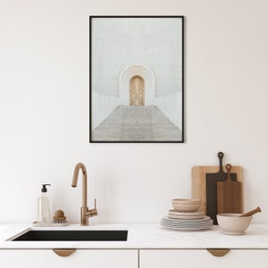 May include: A framed photograph of a white building with a large wooden door and a set of stairs leading up to it. The door is surrounded by a white archway.
