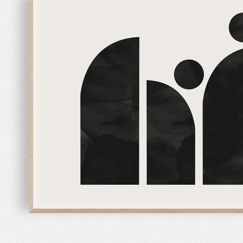 May include: Black and white abstract art print with geometric shapes in the form of a word. The print features a rounded rectangle, a circle, and a half-circle.