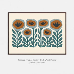 May include: A framed poster featuring a stylized floral design. The artwork showcases orange and blue flowers with dark blue centers, set against a cream background. The dark wood frame surrounds the print. The poster measures 20x28 inches.