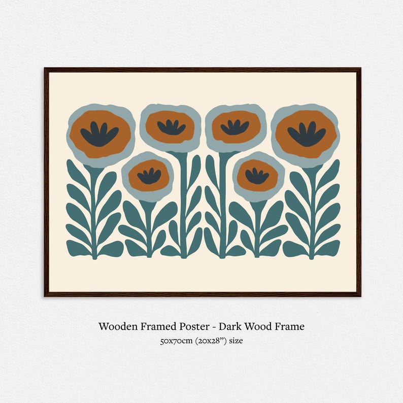 May include: A framed poster featuring a stylized floral design. The artwork showcases orange and blue flowers with dark blue centers, set against a cream background. The dark wood frame surrounds the print. The poster measures 20x28 inches.