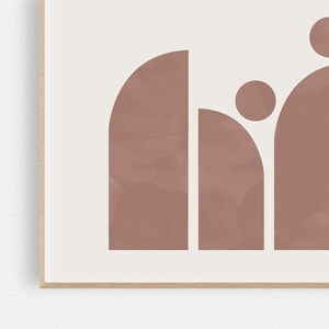 May include: Abstract art print featuring a geometric design of overlapping circles and arches in a muted pink color.