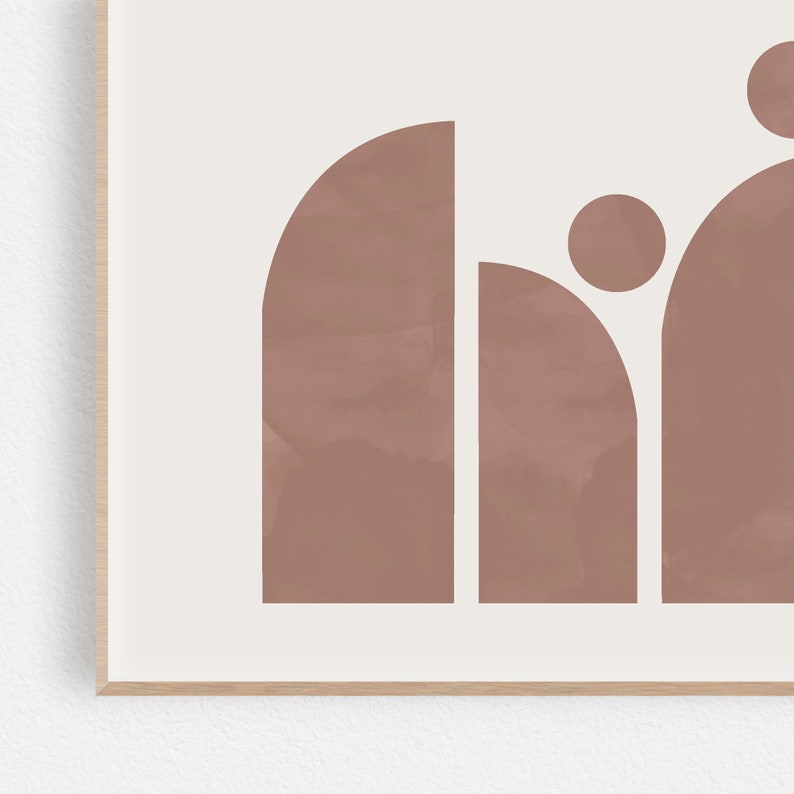 May include: Abstract art print featuring a geometric design of overlapping circles and arches in a muted pink color.