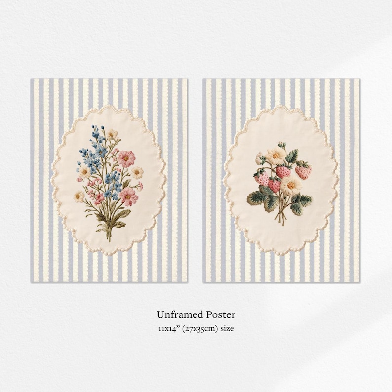 May include: Two unframed posters, each featuring a floral bouquet within an oval, scalloped frame. One bouquet has blue and pink flowers, the other has strawberries. The background is striped in light blue and white. The posters are 11x14 inches.
