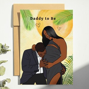 May include: A greeting card with the text "Daddy to Be" and a drawing of a pregnant person and their partner. The illustration features a person in a gray dress and a person in a suit, with a yellow sun and green leaves in the background.