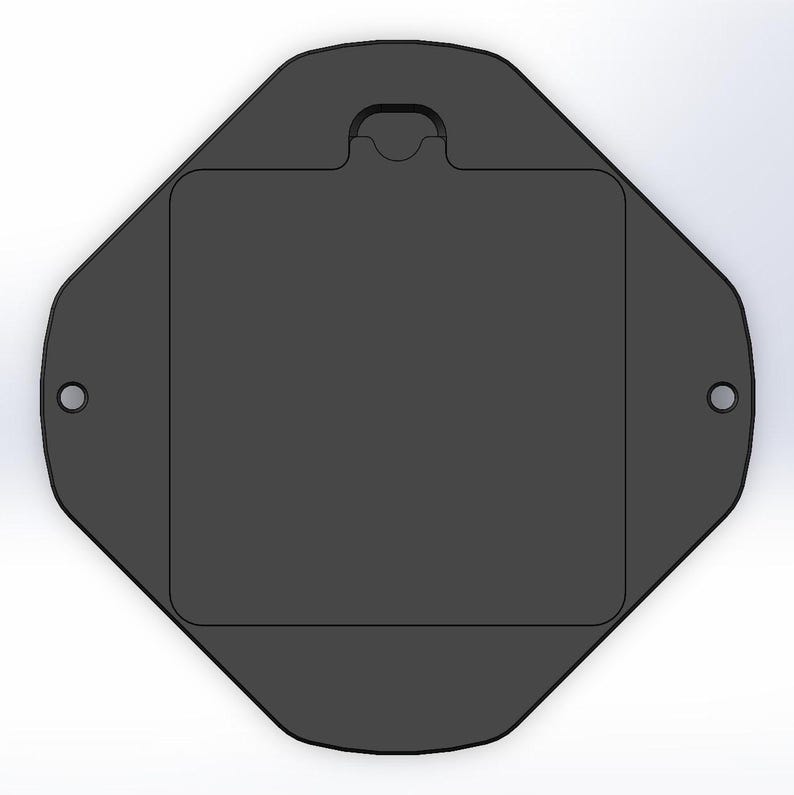 May include: A black octagonal-shaped plastic box with a rectangular opening and a small handle on the top.