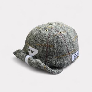 Gorra de tweed Harris a cuadros grises con visera enrollable