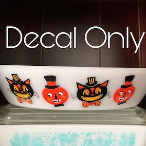May include: White ceramic baking dish with a Halloween themed decal featuring black cats and jack-o'-lanterns. The decal reads "Decal Only".