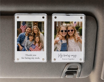 May include: Two rectangular acrylic car visor clips featuring custom photo prints. The left clip shows a family of four with the text Thank you for being my rock. The right clip shows two young girls with the text My kind of crazy. Forever Together.