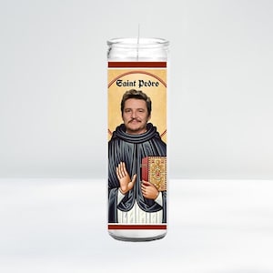 May include: A white candle with a red and gold label featuring a portrait of a man with a mustache and beard. The label reads "Saint Pedro".