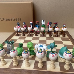 May include: A Plants vs. Zombies themed chess set with detailed character pieces on a wooden chessboard. The set includes zombie and plant figures, with the box reading "WattosChessSets".