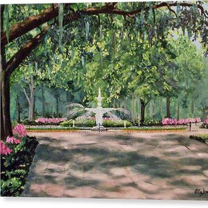 May include: An oil painting depicts a park scene with a white fountain as the focal point. Lush green trees and pink flowers frame the fountain, with a pathway leading towards it. The artwork is signed "Allaben" in the lower right corner.