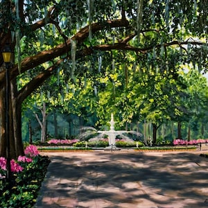 May include: An oil painting depicts a park scene with a white fountain, lush green trees, and vibrant pink flowers. A lamppost stands near a large tree, and the scene is bathed in sunlight, creating a serene atmosphere. The artist's signature is in the bottom right corner.