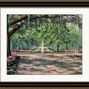May include: A framed painting of a park scene with a fountain as the focal point. The painting features lush green trees, pink flowers, and a paved pathway. The artwork is set in a black and gold frame.