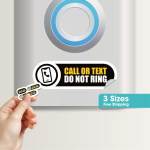 May include: Black and white sticker with rounded corners that says "CALL OR TEXT DO NOT RING" in yellow text. A black and white icon of a phone with a receiver is to the left of the text. The sticker is on a white surface.