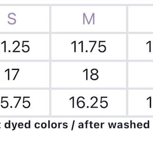 May include: A white size chart table with purple text headers for Chest, Waist, and Length across sizes S, M, L, and XL. The table includes numerical values for each category. Below the table, text reads: *Size chart for garment dyed colors / after washed non garment dye colors*