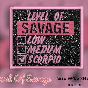 May include: Pink and black embroidered iron-on patch with the text "Level of Savage" and a checklist with the options "Low", "Medium", and "Scorpio" checked. The patch measures 4.5 inches wide by 3.8 inches high.
