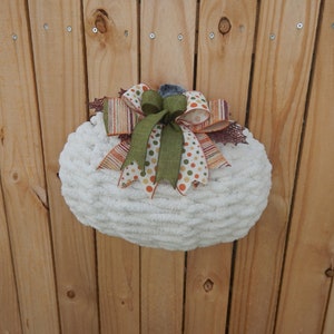 Fall Pumpkin wreath with fall leaves. Interior wall decor.