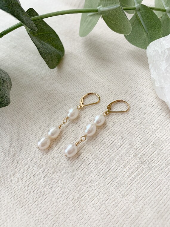 Uneven pearl earrings sale