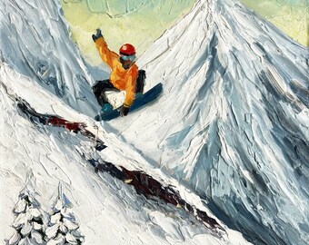 May include: A painting of a snowboarder in a yellow jacket and red helmet, performing a trick on a snowy mountain. The mountain is painted in shades of white and blue, with a bright blue sky in the background.