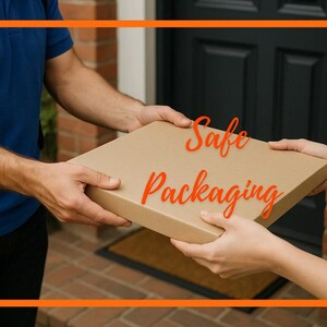 May include: A flat, square cardboard shipping box held between two sets of hands. The box is light brown with a smooth, matte surface. The text "Safe Packaging" is written in a bright orange, cursive font across the center of the box.