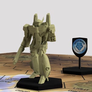 May include: A light tan robot figurine stands on a black base, with a shield-shaped emblem nearby. The robot has a detailed design with multiple articulated parts. The emblem has the text "BRIAN BANZAI" and a diamond design. The background is a hexagonal grid.